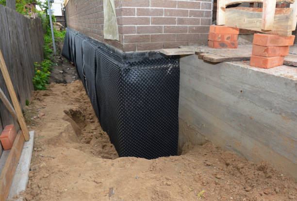 Happy homeowners after waterproofing job in Freetown